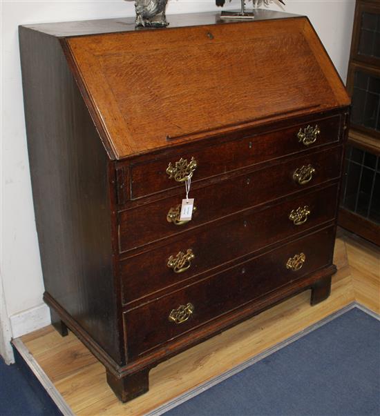 A George III oak bureau W.96cm